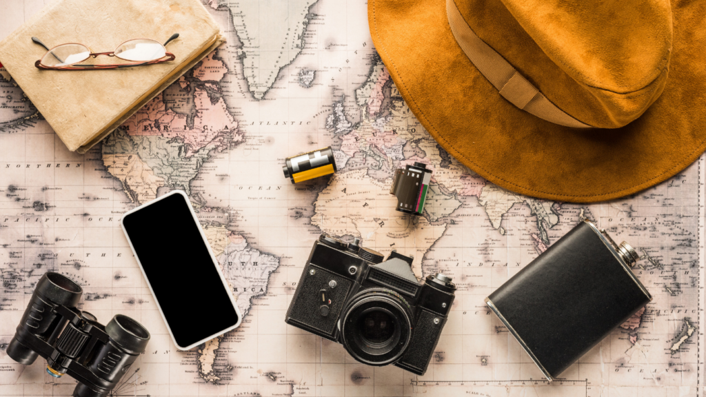 Travel essentials above a map