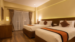 a hotel room with wooden floors and a large bed