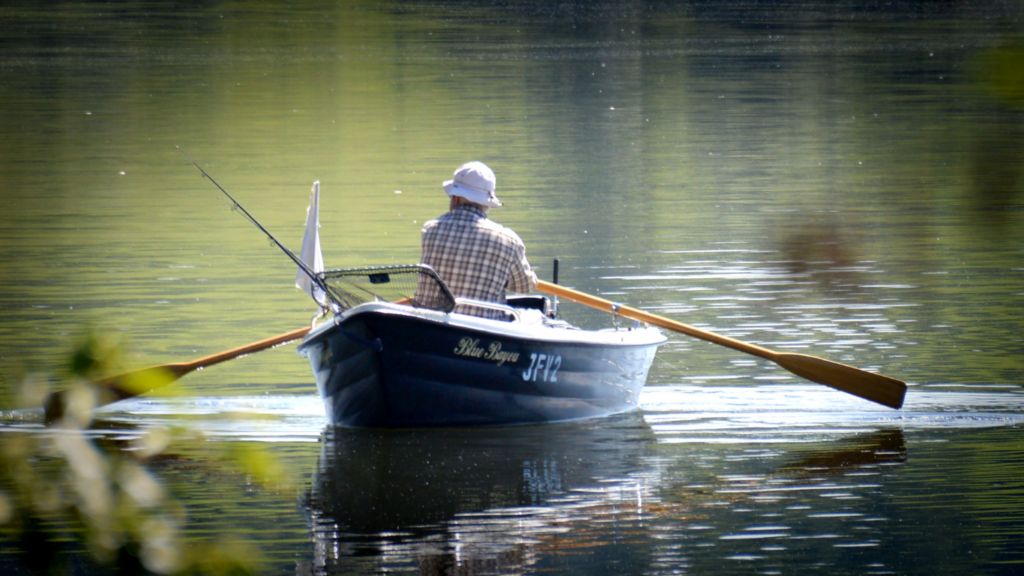 a person paddles a canoe