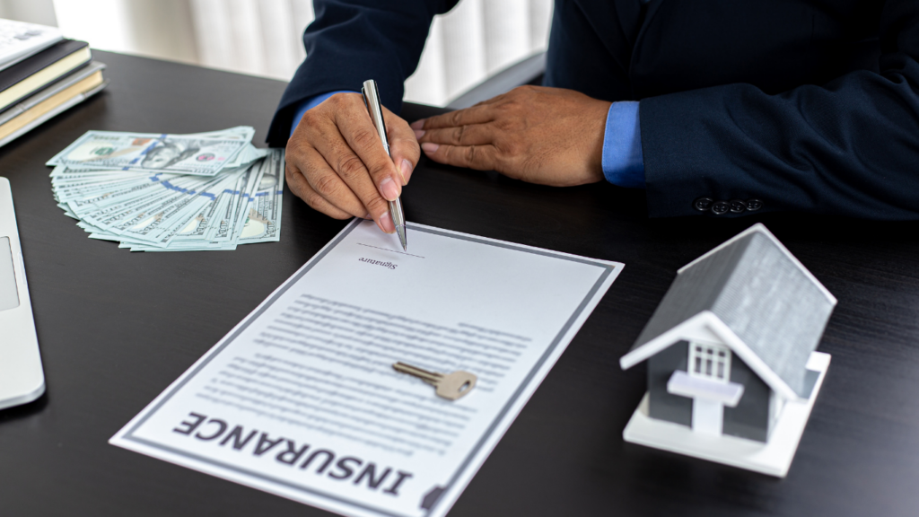 people sitting at a table with an insurance document