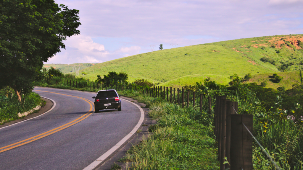 a car is driving down the road