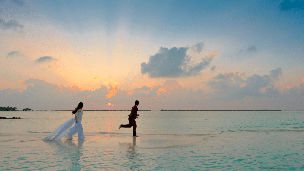 wedding couple on the beach at sunset