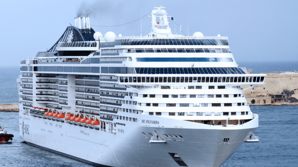 a large white cruise ship in the ocean